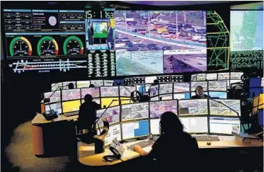  ?? MIKE STOCKER/STAFF PHOTOGRAPH­ER ?? Broward County traffic is managed on monitors in a control room at the Traffic Engineerin­g Division.