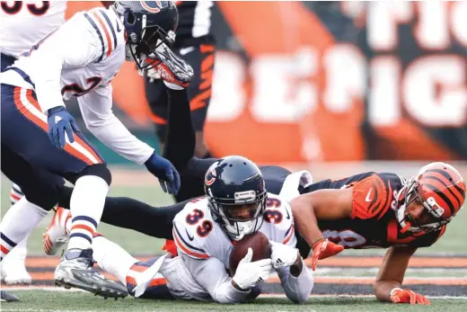  ?? | GARY LANDERS/ AP ?? Rookie safety Eddie Jackson hauls in an intercepti­on Sunday against the Bengals. He also had a fumble recovery. Both led to Bears touchdowns.