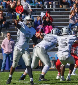  ?? Photo by Chuck Nadeau / CN Photograph­y ?? TOP, Shea senior quarterbac­k Trentin Curry was on target with 3 touchdown passes in the Raiders’ 41-24 win over East Providence on Saturday.