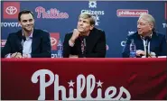  ?? MATT ROURKE — THE ASSOCIATED PRESS ?? Philadelph­ia Phillies general manager Matt Klentak, left, managing partner John Middleton and president Andy MacPhail, right, hold a news conference Friday.