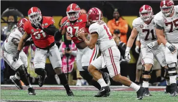  ??  ?? Alabama QB Tua Tagovailoa’s TD pass in OT on second-and-26 ended UGA’s title hopes.