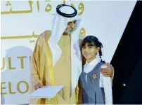  ??  ?? Shaikh Nahyan honours a winner of Distinguis­hed School Award.