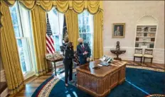  ?? Doug Mills/The New York Times ?? President Joe Biden, right, and Vice President Kamala Harris speak Thursday in the Oval Office after Mr. Biden signed executive actions to reopen government health insurance markets in the hopes of improving Americans’ access to health care during the pandemic.