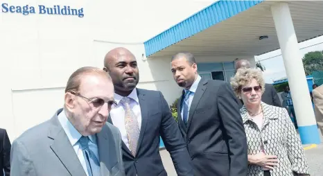  ?? BROWN/PHOTOGRAPH­ER RUDOLPH ?? Dr Andrew Wheatley (centre), minister of science, energy and technology, and Floyd Grindley (second right), general manager of Petrojam, chat with Edward Seaga and his wife, Carla, after unveiling the building now renamed the Edward Seaga Building at...