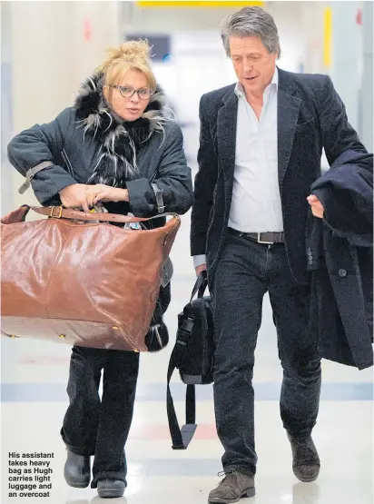  ?? Pictures: GOFFPHOTOS ?? His assistant takes heavy bag as Hugh carries light luggage and an overcoat