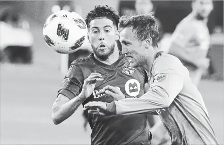  ?? TORONTO STAR FILE PHOTO ?? Toronto FC midfielder Jonathan Osorio, left, battles with Seattle midfielder Magnus Eikrem in a 2-1 Sounders victory at BMO Field on May 9.