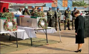  ?? AP ?? Hilde Johnson of Norway, U.N. special representa­tive and head of the U.N. Mission in South Sudan, pays her respects Saturday in Juba, South Sudan, at the caskets of two peacekeepe­rs from India who were killed Thursday in a rebel attack on their base in...