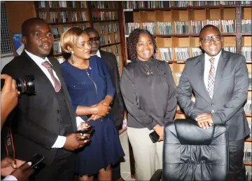  ?? - Picture: Kudakwashe Hunda ?? Informatio­n, Publicity and Broadcasti­ng Services Minister Dr Jenfan Muswere (right) is taken through music archiving stages by ZBC chief executive Ms Adelaide Chikunguru (second from right) in the presence of radio DJs during a tour of ZBC Mbare Studios last year.