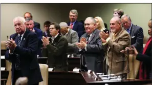  ?? Arkansas Democrat-Gazette/THOMAS METTHE ?? Lawmakers applaud Wednesday as Gov. Asa Hutchinson leaves the room after presenting his proposed state budget.