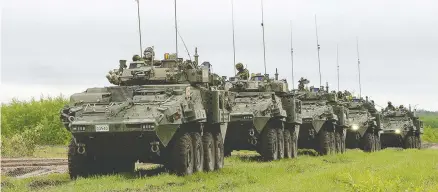  ?? SGT JEAN-FRANCOIS LAUZ / COMBAT CAMERA / GENERAL DYNAMICS ?? Canadian light armoured vehicles move in a convoy in the Wainwright Garrison training area during exercises there in 2016. The Defence Department has announced a new sole-source deal to buy 360 armoured vehicles from General Dynamics Land Systems Canada for $3 billion.