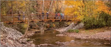  ?? COURTESY OF REGAN MOLL-DOHM OF BERKS NATURE ?? People walking across the recently opened Hay Creek Pedestrian Bridge that connects Rustic Park to the Birdsboro Waters Preserve.
