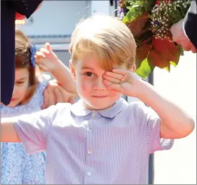  ?? REUTERS ?? Prince George and Princess Charlotte arrive at Tegel airport in Berlin, Germany, on Wednesday.