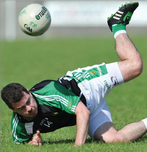  ??  ?? Ben Rogan, O’Raghallaig­h’s and Darren O’Hanlon, St. Patrick’s compete for possession during their SFC clash at The Grove on Sunday.