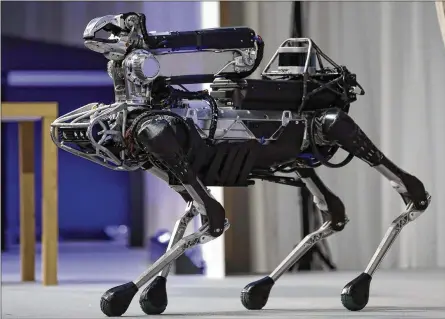  ?? KIYOSHI OTA / BLOOMBERG 2017 ?? Boston Dynamics’ SpotMini robot is demonstrat­ed in Tokyo in July 2017. The company is testing SpotMini with potential customers from several industries.