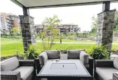  ??  ?? The large wraparound deck off the condo’s living room looks out to the Travino Living developmen­t’s main water feature.