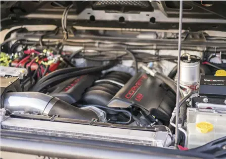  ??  ?? It's rare that you open a Jeep Wrangler hood and find a massive 6.2L V-8 LS3 GM Performanc­e engine!