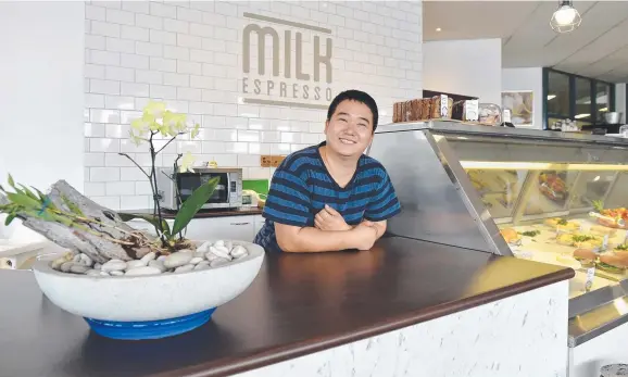  ??  ?? ALL SMILES: Owner Ben Kim at his Milk Espresso cafe which has opened at Hyde Park.