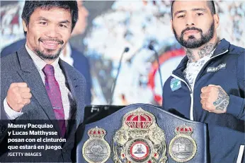  ?? /GETTY IMAGES ?? Manny Pacquiao y Lucas Matthysse posan con el cinturón que estará en juego.