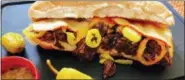  ?? ELIZABETH KARMEL VIA AP ?? This Tuesday photo shows a pickled pepper pull-apart beef hoagie in Amagansett, N.Y. this dish is from a recipe by Elizabeth Karmel.