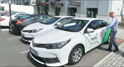  ?? REUTERS ?? A Taxify driver enters his car in Tallinn, Estonia.