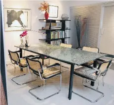  ?? PHOTOS: MARIE- FRANCE COALLIER ?? The dining room in Donaldson’s 1,650-square-foot condo is beautifull­y decorated with a rectangula­r dining table with a green granite top, which doubles as a conference table. Around the table are several Breuer chairs with cane backs and seats.