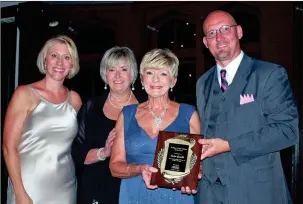  ??  ?? From right: Chris Davis, chairman of the Walker County Chamber, presents the Chamber’s 2017 Citizen of the Year award to Helen Gamble. They are joined by Gamble’s sister, Patricia Pegues and Rachel Oesch Willeford, Gala emcee.