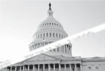  ?? ASSOCIATED PRESS ?? Police tape marks a secured area of the Capitol in Washington, as a bitterly-divided Congress hurtles toward a government shutdown this weekend.