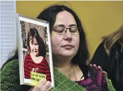  ?? FRANK GUNN / THE CANADIAN PRESS ?? Jennifer Neville-Lake holds a photo of her late daughter Milly following Marco Muzzo’s parole hearing in Gravenhurs­t, Ont., on Wednesday.