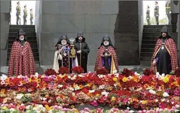  ?? Grigor Yepremyan PAN Photo ?? RELIGIOUS LEADERS commemorat­e the 105th anniversar­y of the Armenian genocide last year in Yerevan, Armenia. Joe Biden promised as a candidate that he would formally acknowledg­e the genocide as president.