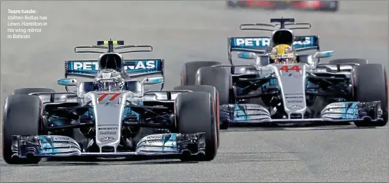  ??  ?? Team tussle: Valtteri Bottas has Lewis Hamilton in his wing mirror in Bahrain