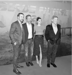  ??  ?? Director of the movie Denis Villeneuve (second left) and cast members Ryan Gosling (left), Ana de Armas (second right) and Harrison Ford (r ight) attend a photocall for the film ‘Blade Runner 2049’ in Paris, France, recently. — Reuters photo