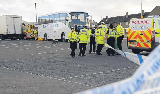  ?? Picture: David Wardle. ?? Emergency services survey the car park where the accident occurred yesterday.