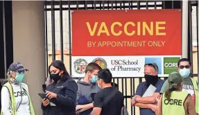  ?? FREDERIC J. BROWN/AFP VIA GETTY IMAGES ?? The CDC says people who have been vaccinated don’t need to quarantine or get tested unless they’re symptomati­c.