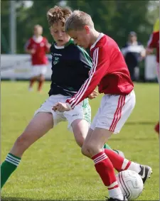  ??  ?? James Lawless of Moyne Rangers under pressure from Conor Mullan (Forth Celtic) in the Under-13 Cup decider.