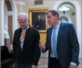  ?? AP PHOTO/J. SCOTT APPLEWHITE ?? Sen. Tim Kaine, D-Va., left, and Sen. Mark Warner, D-Va., arrive as the Senate holds a procedural vote on a package of wartime funding for Ukraine, Israel and other U.S. allies, at the Capitol in Washington, Friday, Feb. 9, 2024.