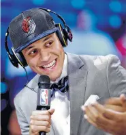  ?? Frank Franklin II photos / Associated Press ?? North Carolina’s Justin Jackson, left, is interviewe­d after being picked 15th by Portland before being traded to Sacramento, where he will be reunited with former AAU teammate De’Aaron Fox.