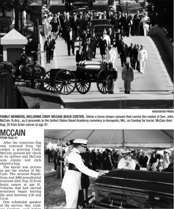  ?? ASSOCIATED PRESS ?? FAMILY MEMBERS, INCLUDING CINDY MCCAIN (BACK CENTER) follow a horse-drawn caisson that carries the casket of Sen. John McCain, R-Ariz., as it proceeds to the United States Naval Academy cemetery in Annapolis, Md., on Sunday for burial. McCain died Aug. 25 from brain cancer at age 81.