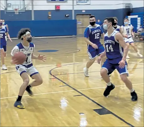  ?? NICK MALLARD / SENTINEL & ENTERPRISE ?? Leominster's Kevin Viola drives against Narraganse­tt's Andrew Stillman during Monday's game.