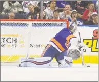  ?? Gregory Vasil / For Hearst Connecticu­t Media ?? Islanders goalie Thomas Greiss makes a save during a preseason game against the Rangers on Saturday at Webster Bank Arena in Bridgeport.