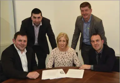  ??  ?? Tony and Donal Fitzgerald of OCF Charlevill­e (front) with fellow directors Mark McKenna (back left) and Paul Neenan with office manager Martina Morrissey at the opening of their new offices at the town centre Charlevill­e.