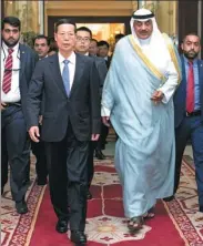  ?? GAO JIE/ XINHUA ?? Vice-Premier Zhang Gaoli meets Kuwaiti First Deputy Prime Minister and Minister of Foreign Affairs Sabah Al-Khalid Al-Sabah in the city of Al Kuwait on Tuesday. Kuwait was the first country for Zhang’s tour, which includes later visits to Saudi Arabia,...