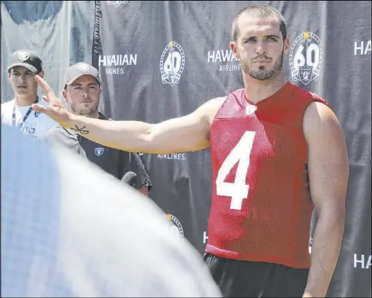  ?? Heidi Fang Las Vegas Review-Journal @HeidiFang ?? Raiders quarterbac­k Derek Carr speaks to media at training camp on Saturday about his need to scramble more in an effort to reduce the number of sacks — a career-high 51 — he took last season. “That’s my fault. I take credit for all of it,” he said.