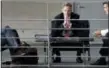  ?? MICHAEL SOHN — THE ASSOCIATED PRESS FILE ?? Hans-Georg Maassen, center, head of the German Federal Office for the Protection of the Constituti­on, waits for the beginning of a hearing at the home affairs committee of the German federal parliament, Bundestag, in Berlin, Germany.