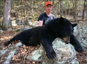  ?? (Photos submitted by Lisa Spray) ?? Wesley Spray, 15, of Myron bagged this black bear Oct. 20 while hunting with his father in the Sylamore Wildlife Management Area. He took an 11-point buck in 2019.