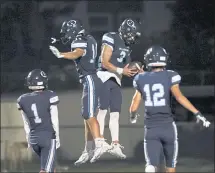  ?? DON FERIA — STAFF PHOTOGRAPH­ER ?? Bellarmine’s Chris Jaeb and Wade Smith celebrate a touchdown in the first quarter against Menlo-Atherton at San Jose City College.