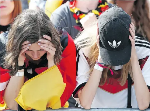  ?? CATHRIN MUELLER / BONGARTS / GETTY IMAGES ?? Fans of Germany are devastated after loss to underdog South Korea on Wednesday.