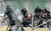  ?? ROSA WOODS/ STUFF ?? The New Zealand Police dive squad take a breather after training drills in Wellington.