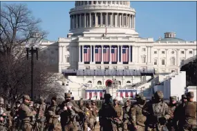  ?? Stefani Reynolds / Getty Images ?? Members of the National Guard stood outside the U.S. Capitol in Washington, D.C., Thursday. About 100 members of the Connecticu­t National Guard have been sent there ahead of Wednesday’s inaugurati­on of President-elect Joe Biden. Similar security measures are underway at the state Capitol in Hartford, and other sites in the state.