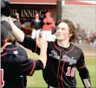  ?? Enterprise-Leader photograph by Mark Humphrey ?? Pea Ridge Blackhawk senior Logan Stewart exchanges high-fives with teammates after hitting a solo home run against Farmington on Friday, April 15, 2022. The Blackhawks lost the 4A-1 Conference game by a 13-6 score.