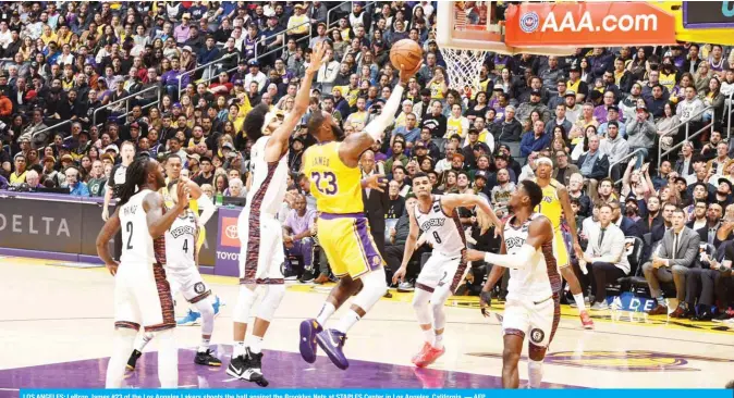  ??  ?? LOS ANGELES: LeBron James #23 of the Los Angeles Lakers shoots the ball against the Brooklyn Nets at STAPLES Center in Los Angeles, California. — AFP